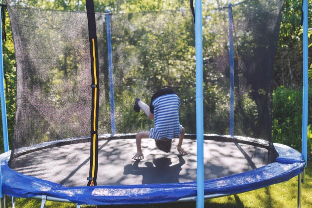 boy-jumping-trampoline-child-is-tumbling-trampoline_427957-1217